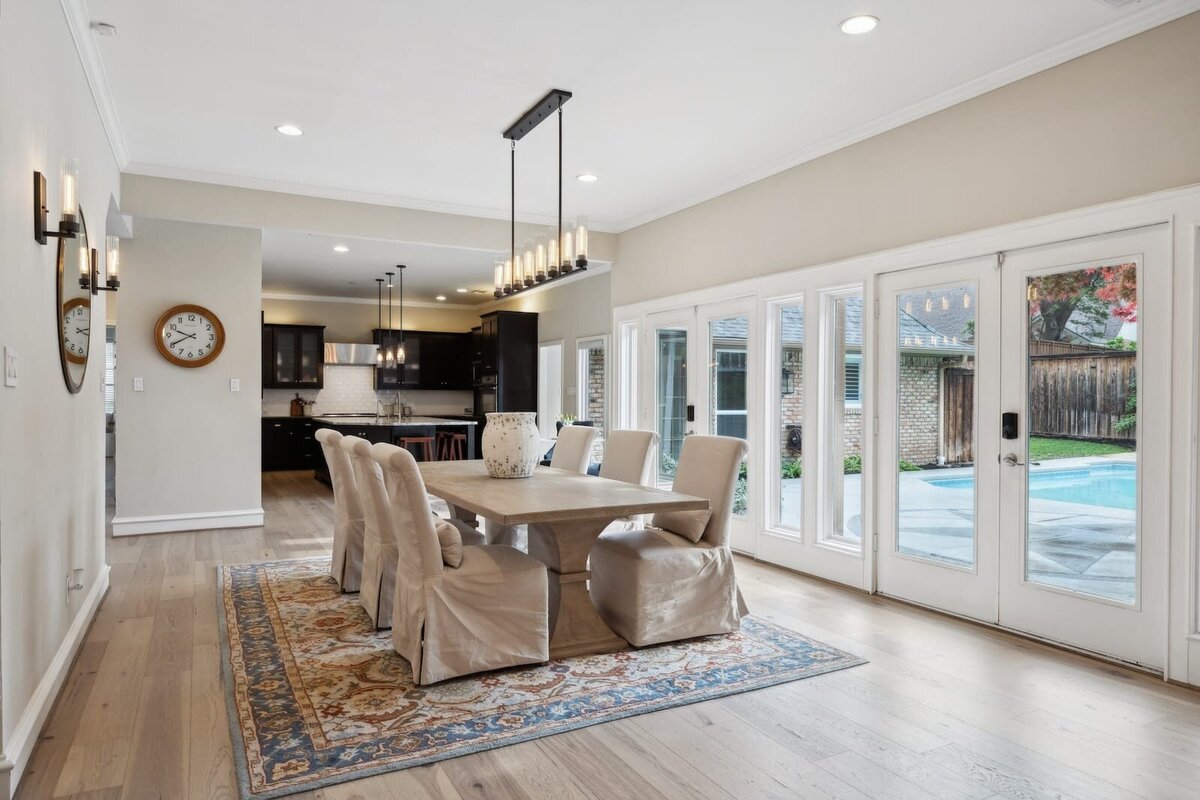 17828_cedar_creek_canyon_dr_dallas_tx_dining_area_with_pool_view_-_natural_light_and_glass_doors_-_haven_realty_group