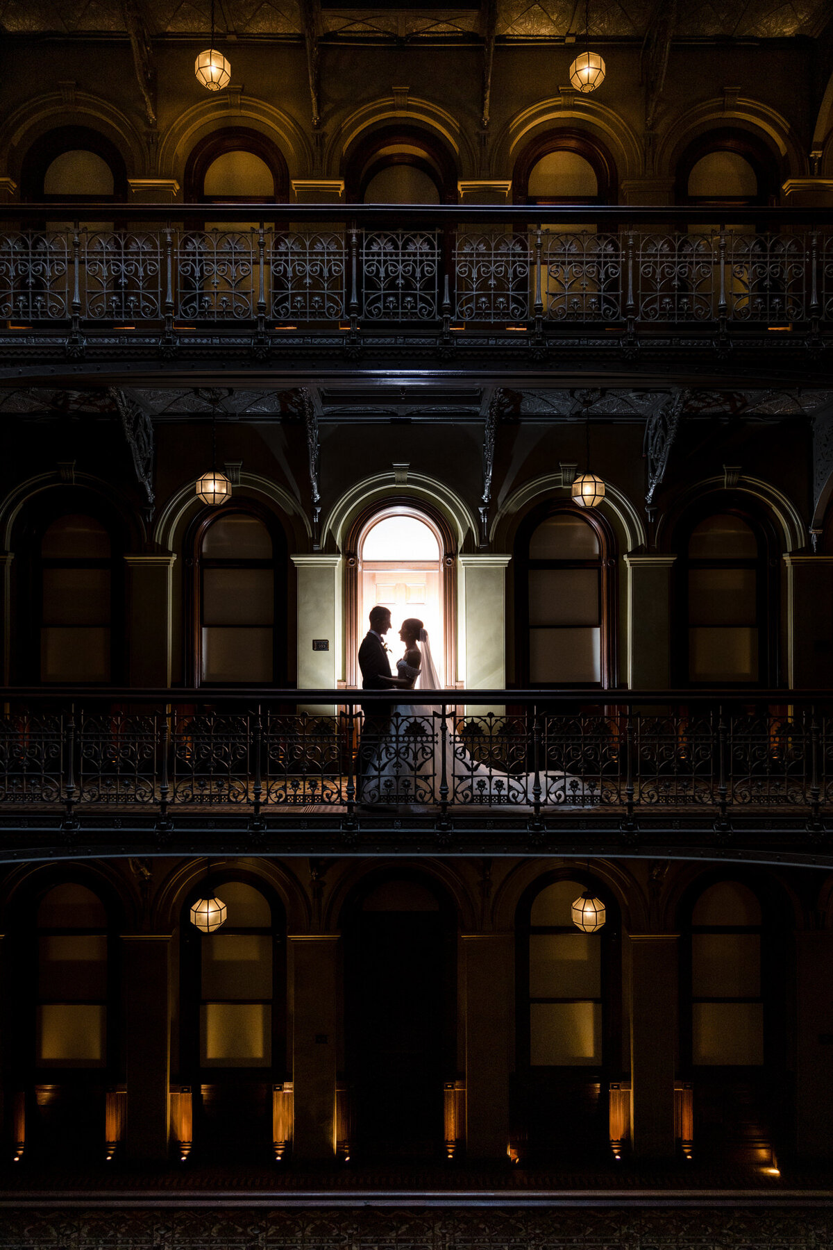 Unique photos in the atrium of a couple at a Beekman Hotel wedding