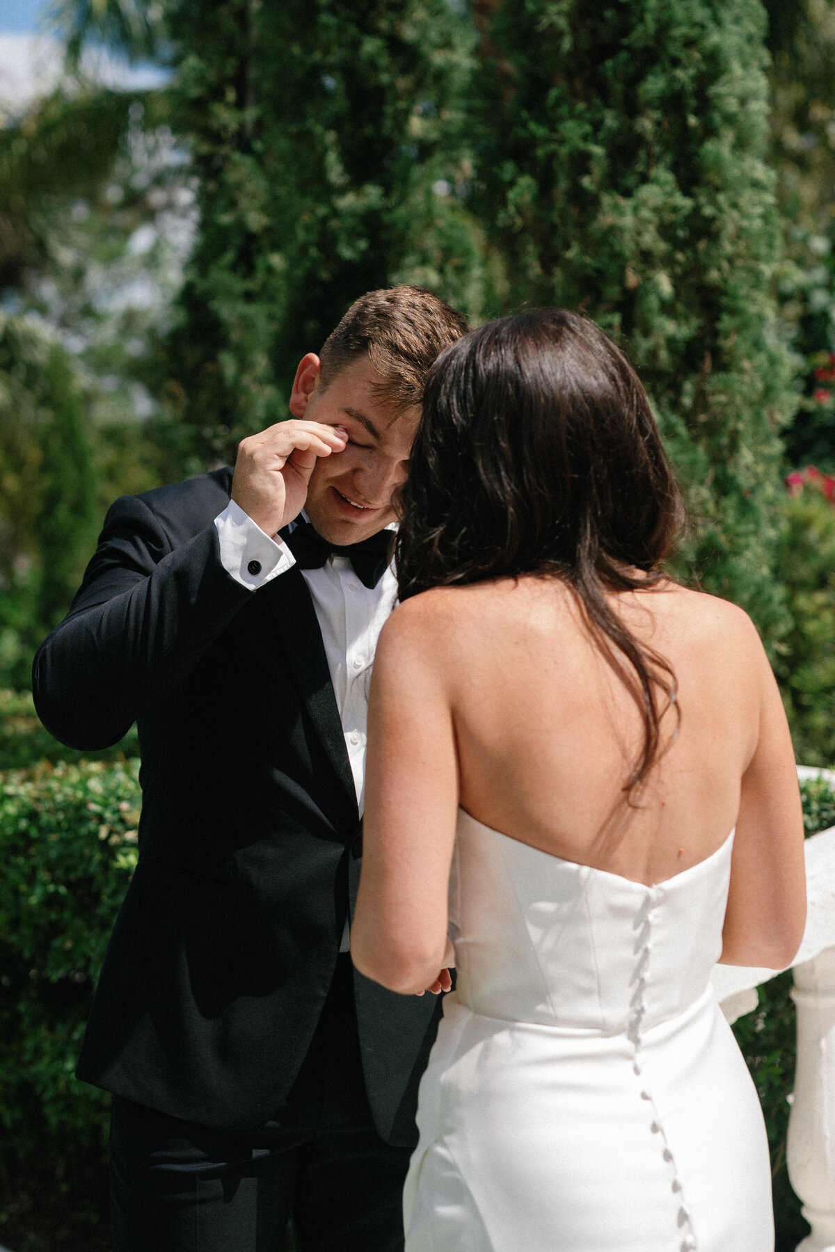Emotional first look moment between bride and groom at La Casa Toscana
