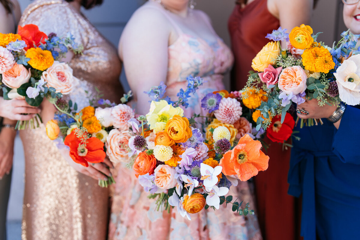 vibrant rainbow color palette for bridal bouquet and bridesmaid bouquets held together