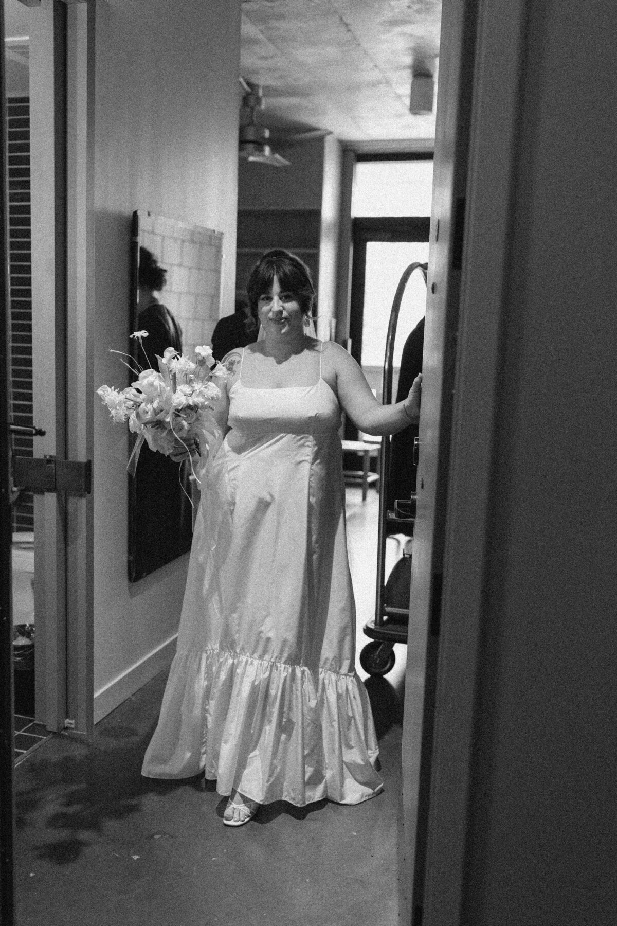 Bride walking through hallway at v