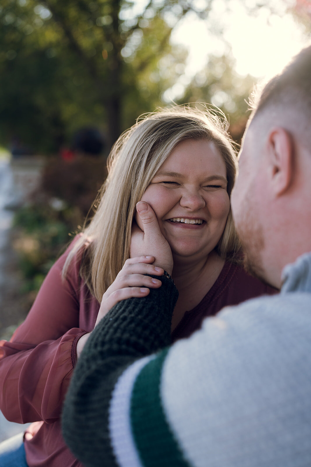 man touching fiancees face lovingly