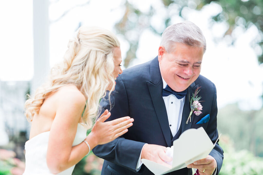 father + bride laughing