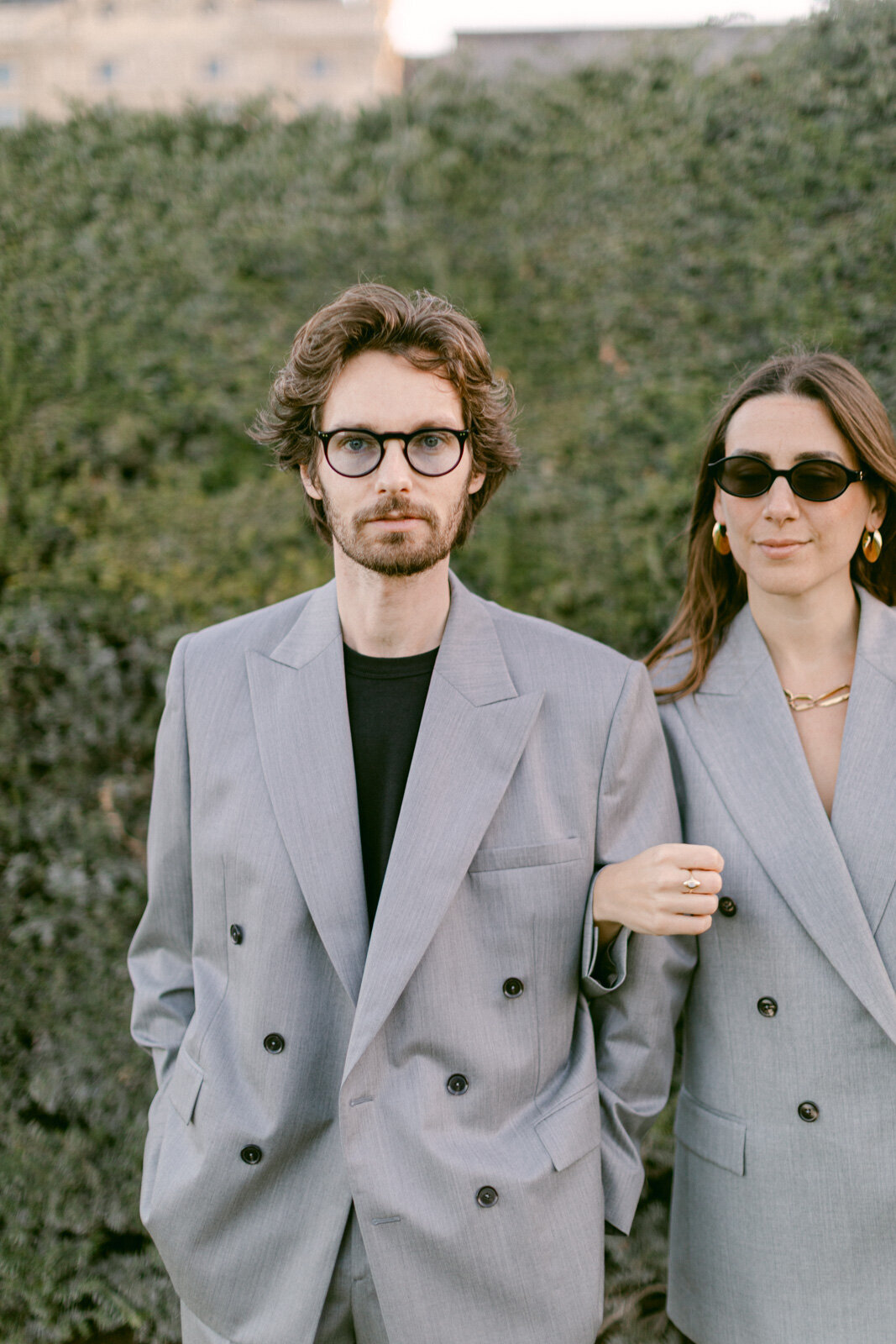 Engagement session at the Tuileries and Louvre in Paris, with a couple walking through the gardens under the morning light.