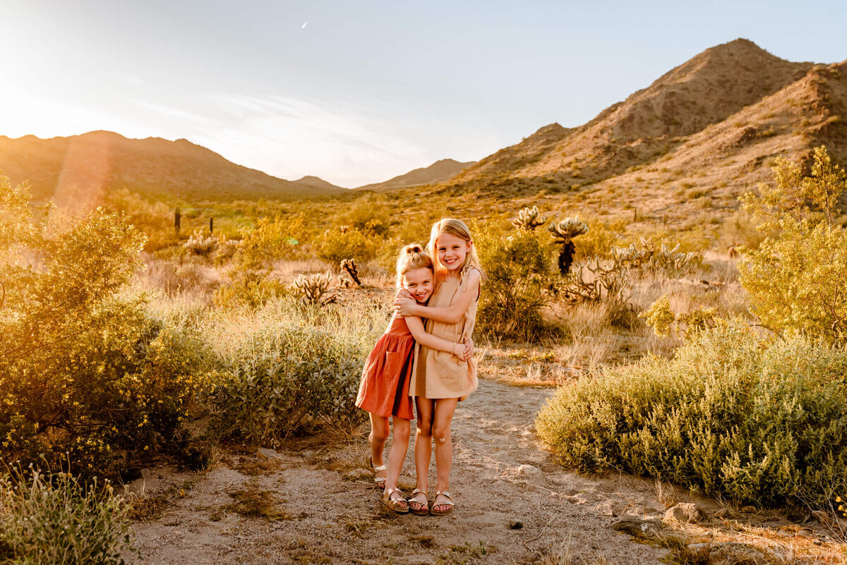 sisters hugging for family photography session in Arizona