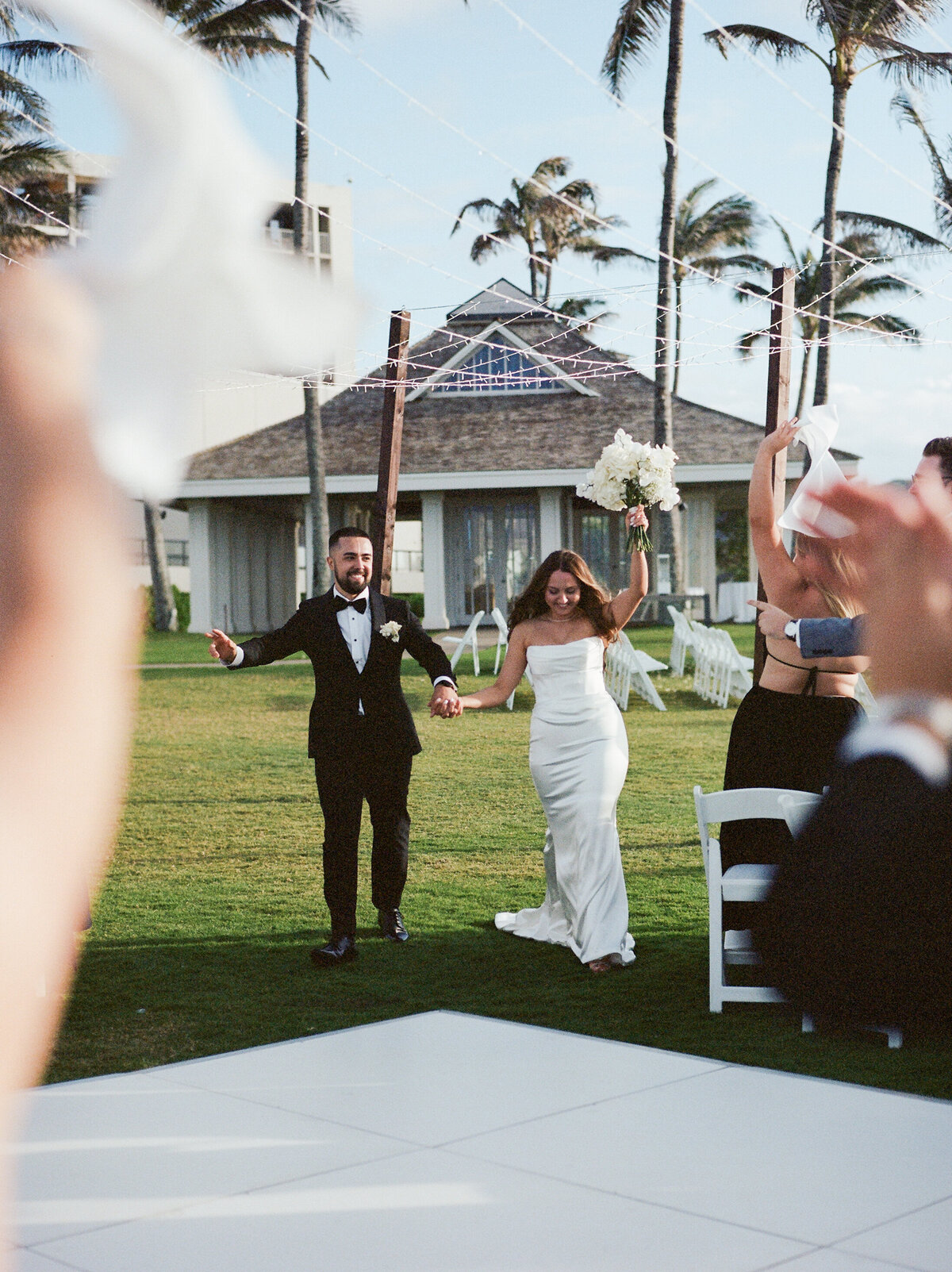 Couple happily walking into the reception, captured in a candid wedding photography style — Carmel wedding photography by Kate Winters Photography.