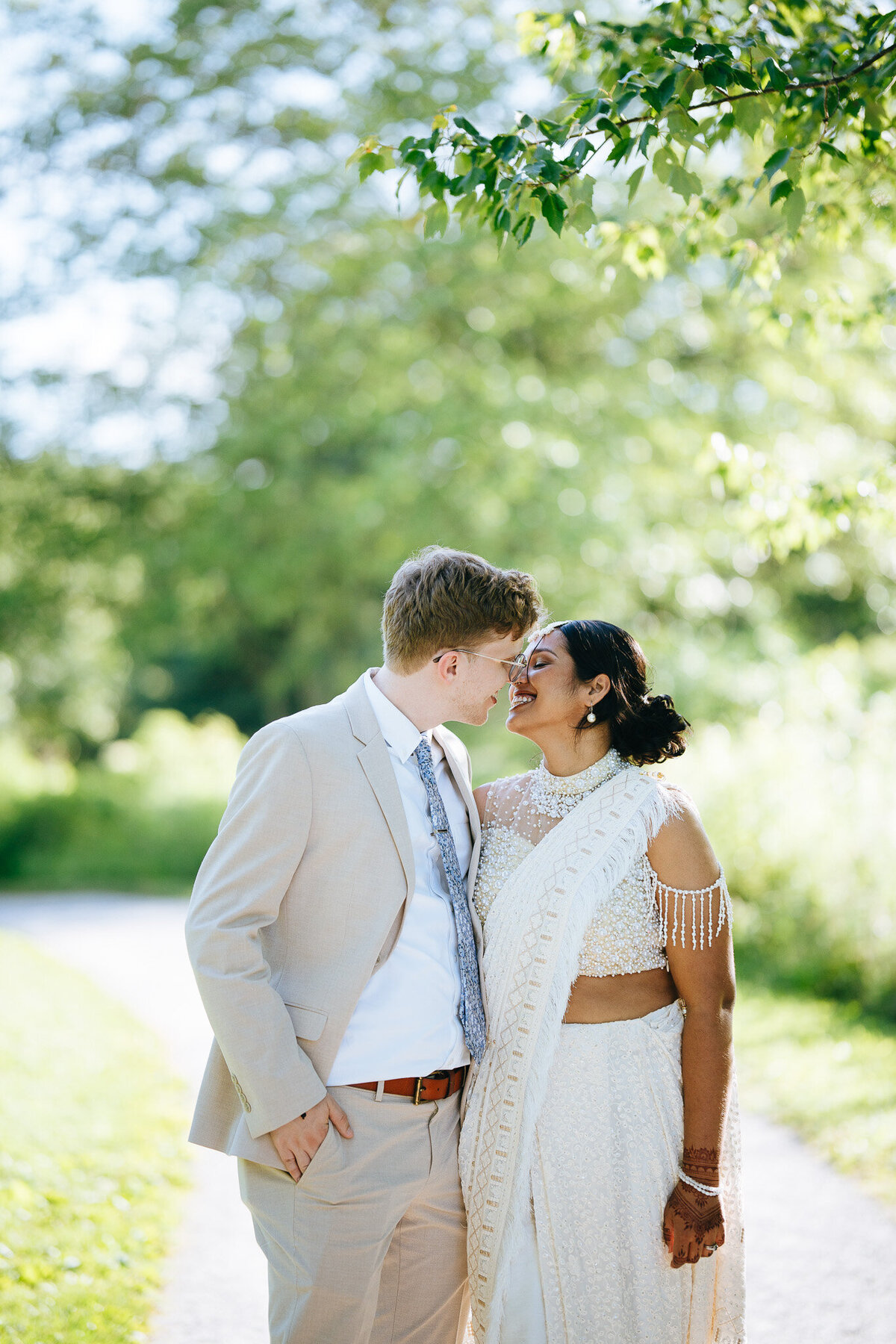 bride and groom about to kiss after wedding ceremony at forest park
