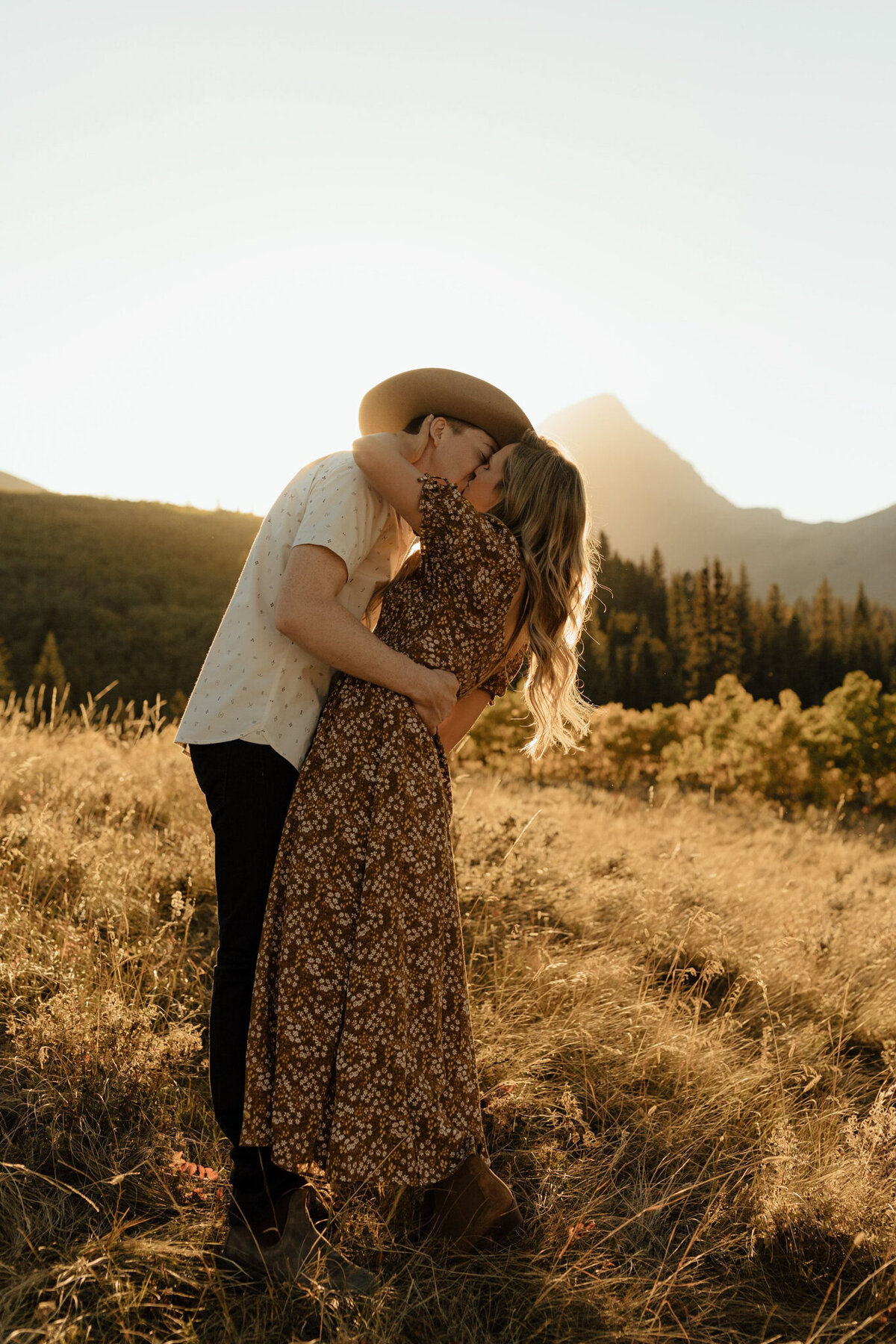 Couple kissing at sunset by Malorie Reiter Photography, adventurous and authentic wedding photographer in Lethbridge, Alberta. Featured on the Bronte Bride Vendor Guide.