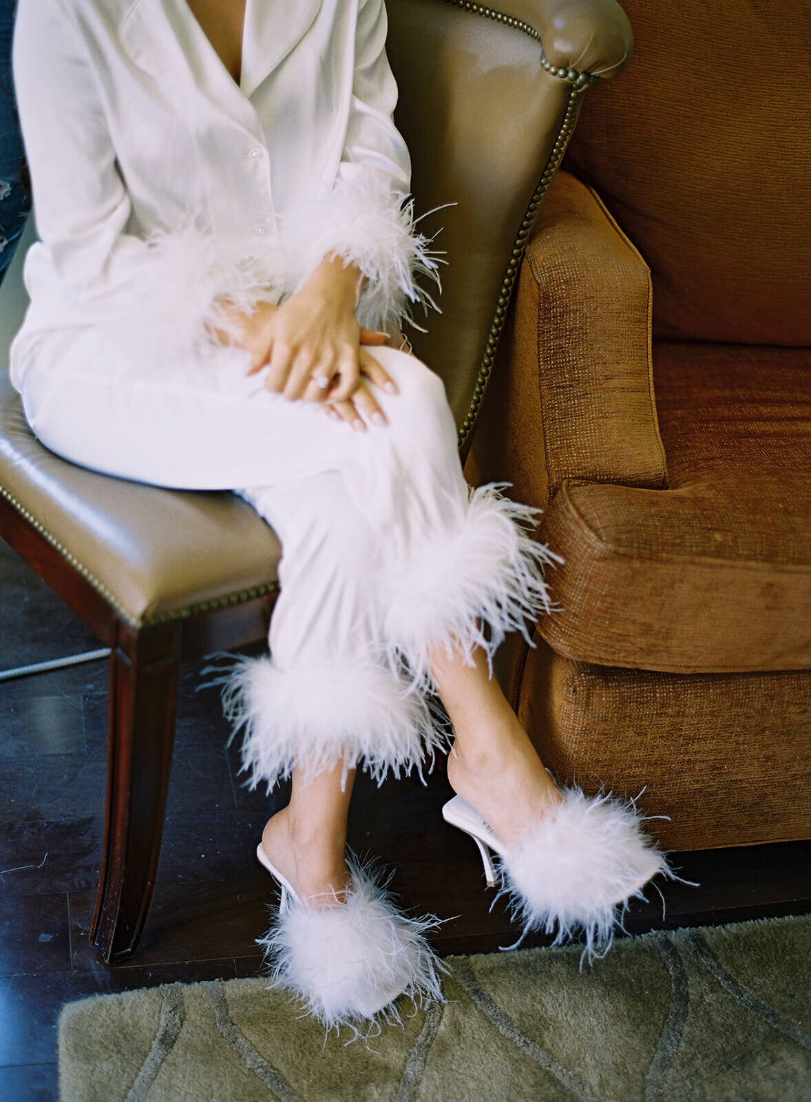 Bride with fuzzy robe and shoes before the wedding ceremony