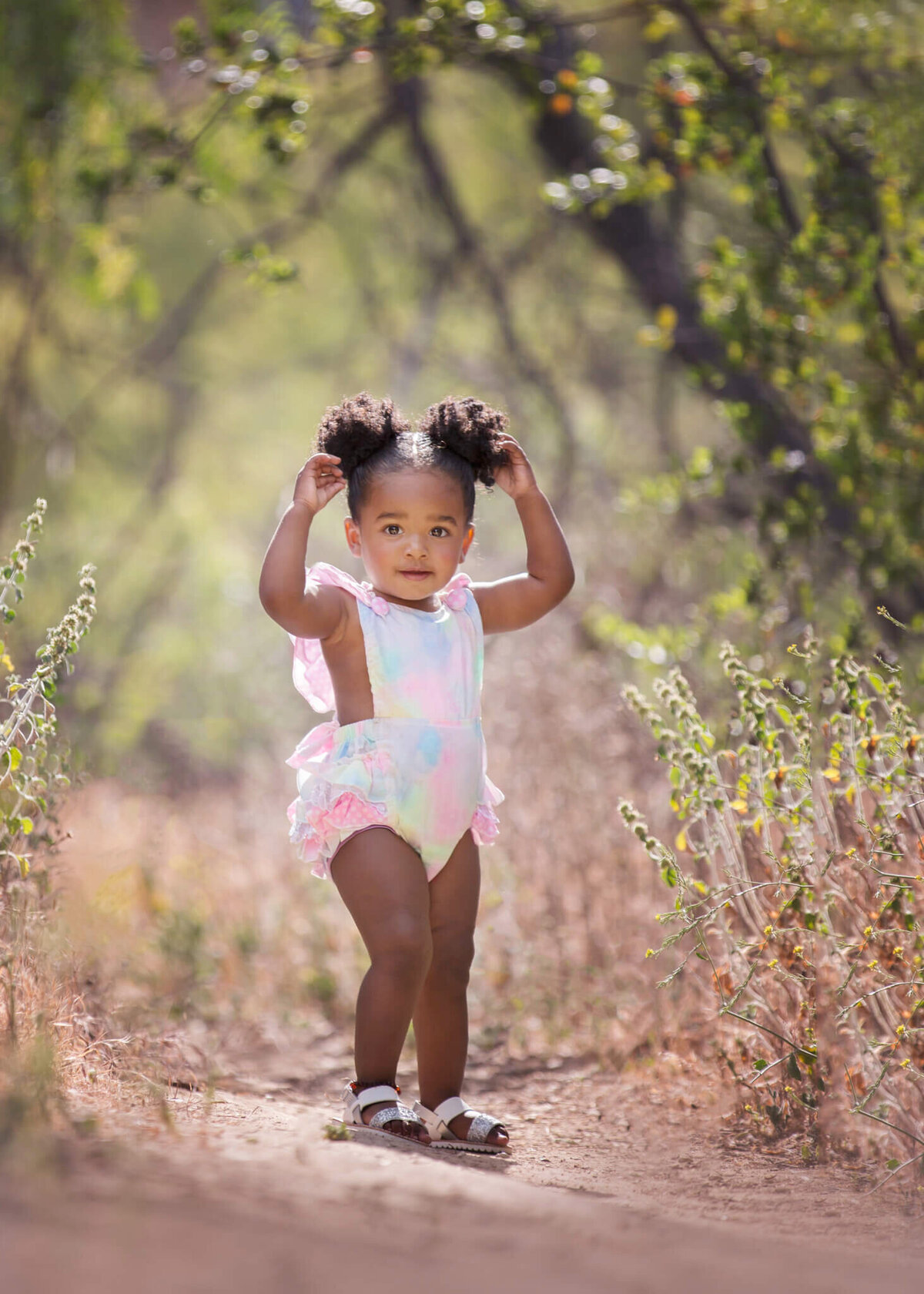 Toddler holding her pigtails in Woodland Hills park - Los Angeles Children’s Photographer