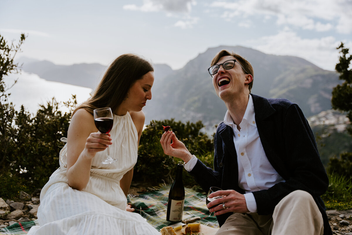 Couple having a picnic above the Amalfi Coast.