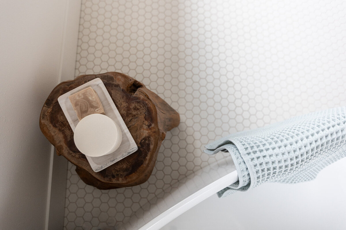 michele rosenboom design clean country renovation bathroom penny tile with wooden table with bar of soap