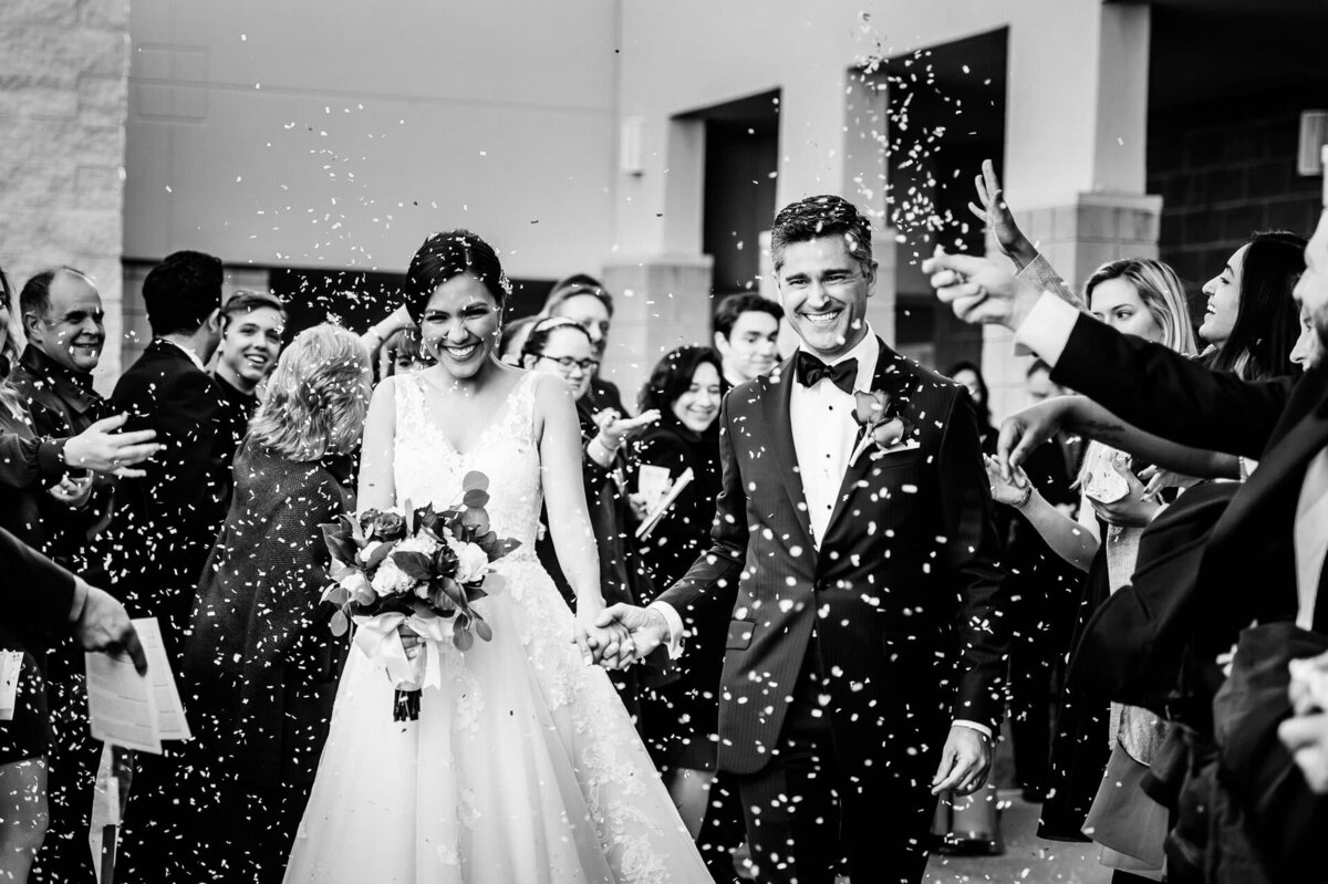 bride and groom exiting church after their ceremony at Saint luke catholic church in el paso texas