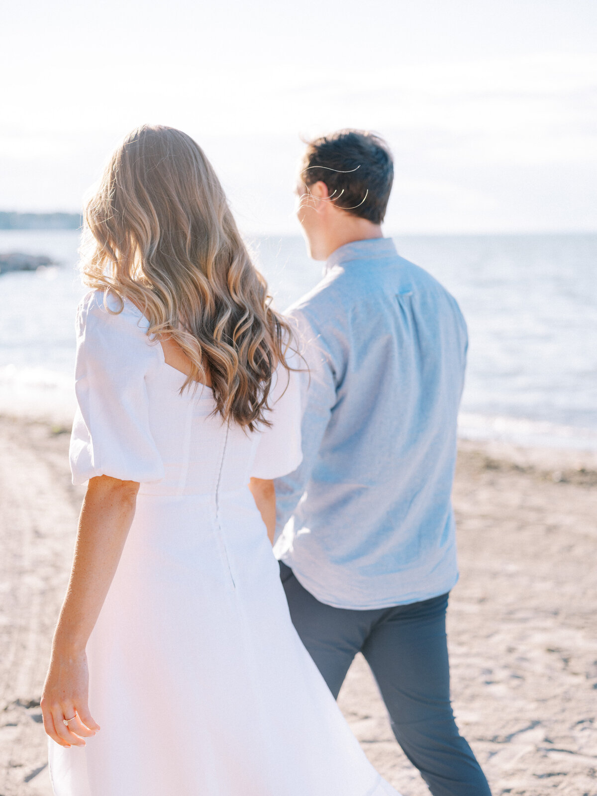 couple-walking-huntington-beach-engagement