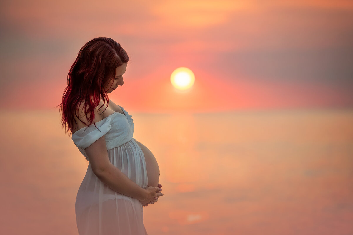 Mommy to be maternity photoshoot during sunset at the beach in Indiana Dunes