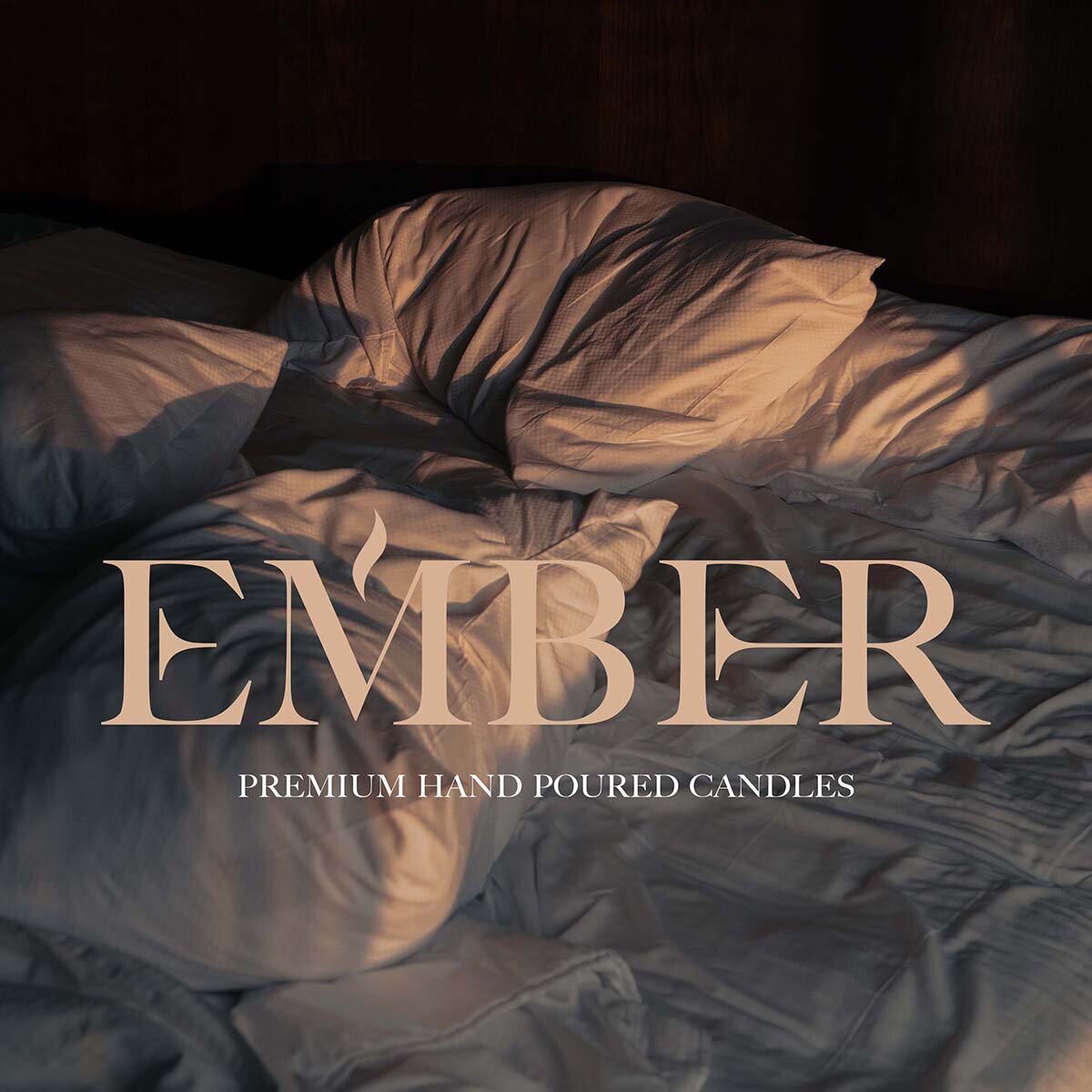 Ember candle brand identity design with logo over moody bedroom scene