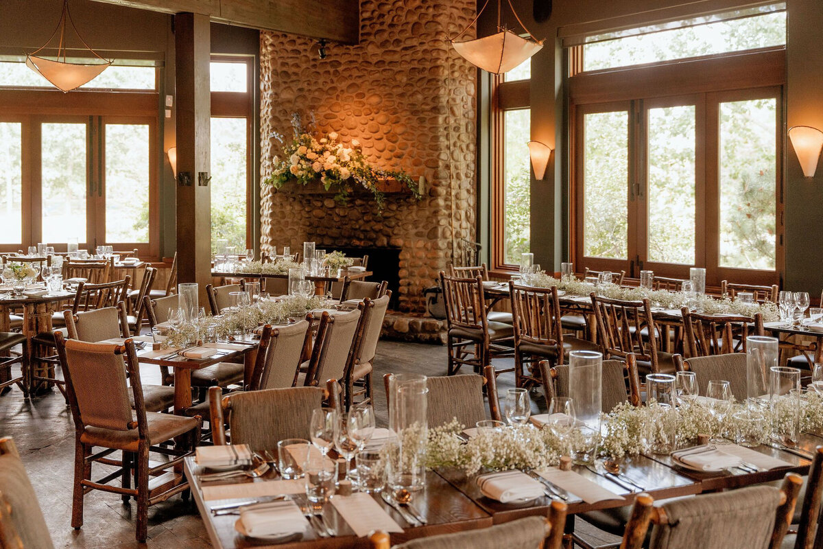 Beautiful and elegant indoor reception at River Cafe, a riverside wedding venue in downtown Calgary, featured on the Brontë Bride Vendor Guide.