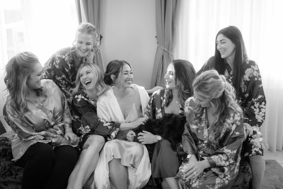 Bride-laughing-with-bridesmaids-New-Orleans-at-maison-de-la-luz-hotel.jpg