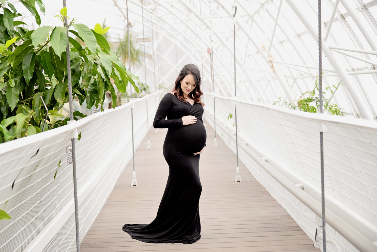 Heather poses for maternity session at Oklahoma Crystal Bridge.