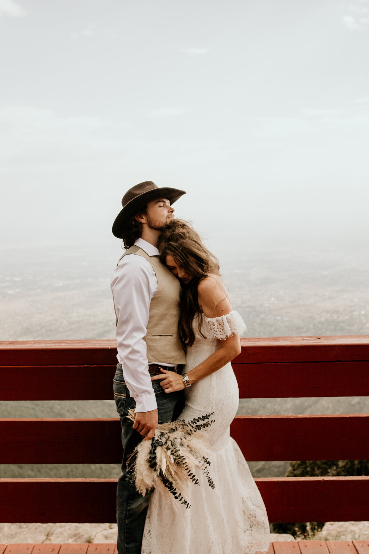Bride and groom hugging intimately at the Sandia Peak Tram