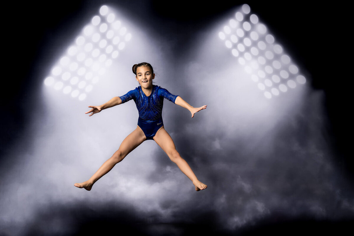 Prescott Storm Elite gymnast jumps in air in Prescott kids photos by Melissa Byrne