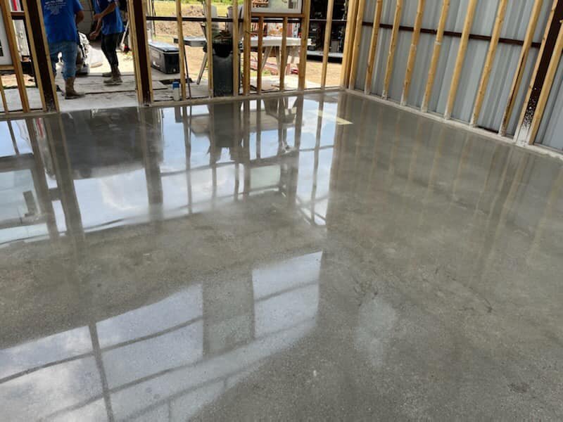 Concrete Polishing Services for Residential Properties in DFW, showcasing a sleek, polished floor in a residential setting, demonstrating quality craftsmanship and professional service.