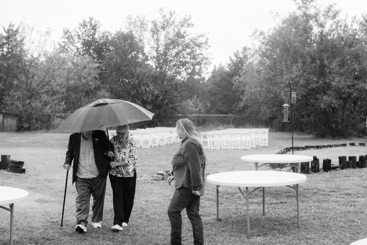 grandparents-walking-in-rain