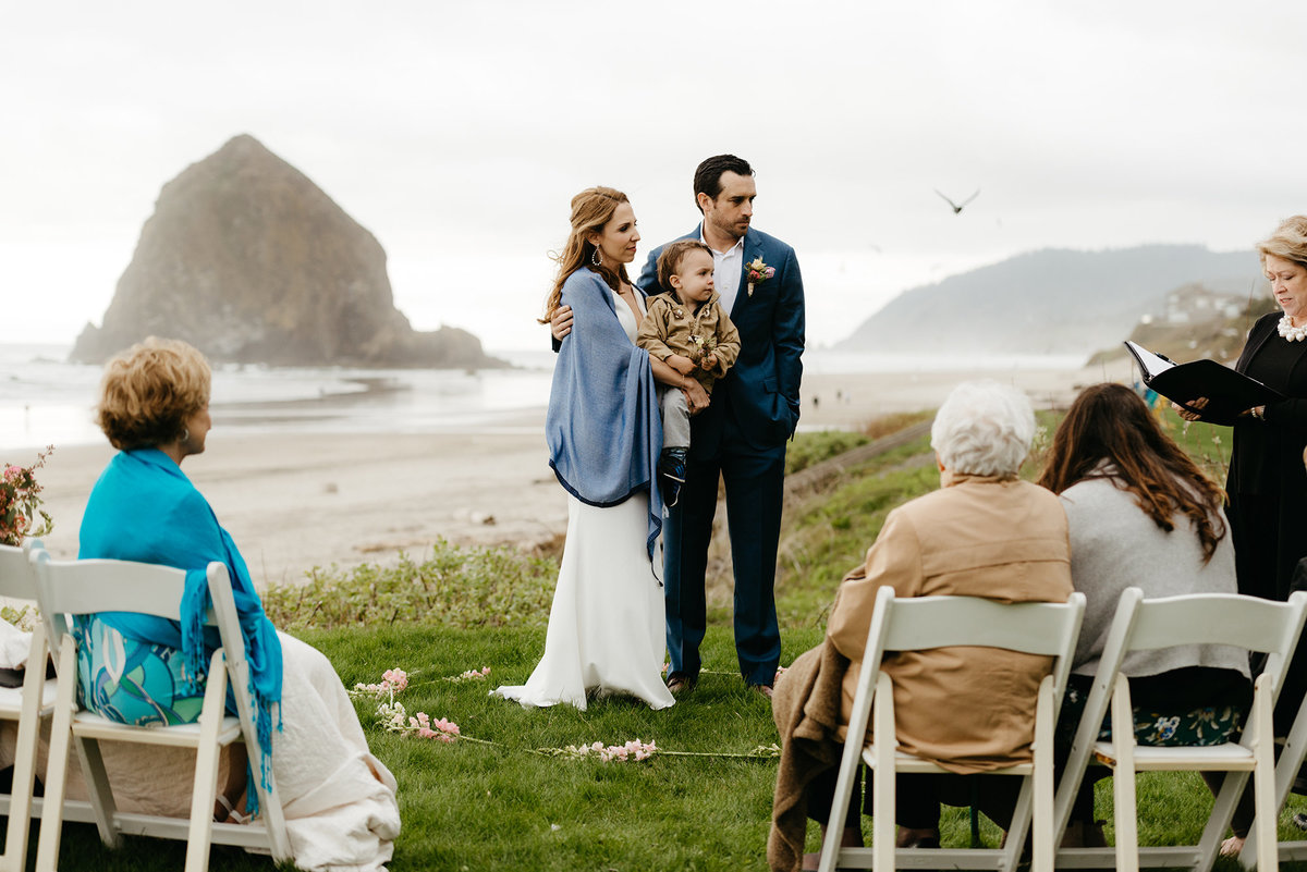 Elopement on the grass at the Stephanie Inn in front of Haystack Rock on the Oregon Coast