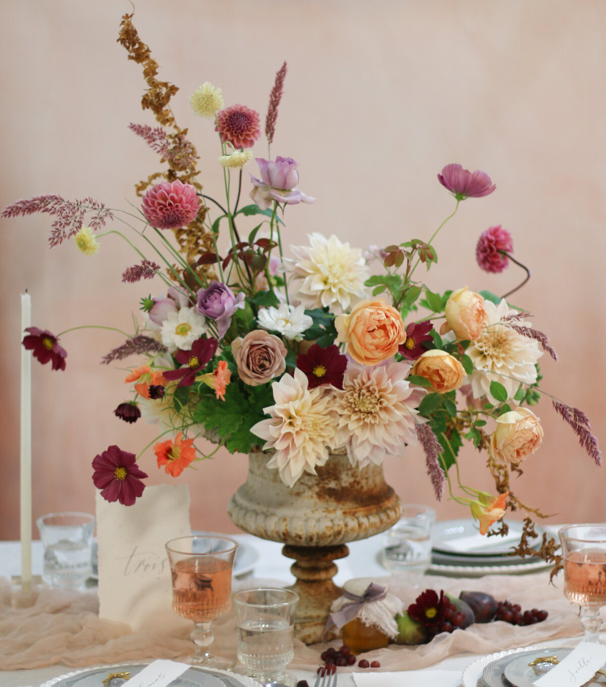 An arrangement of purple, orange and pink flowers decorate a table at a Montreal wedding.