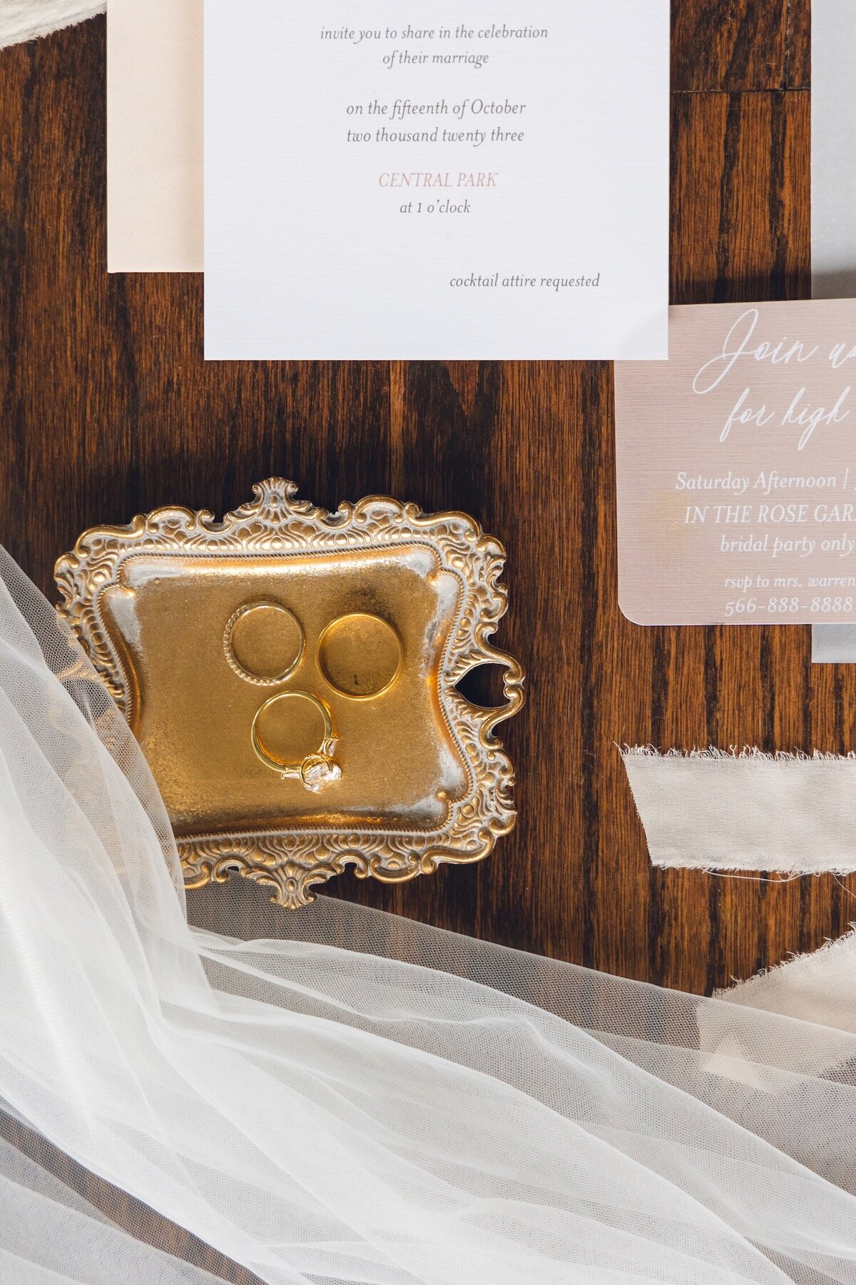 Styled flat lay with rings and invitations