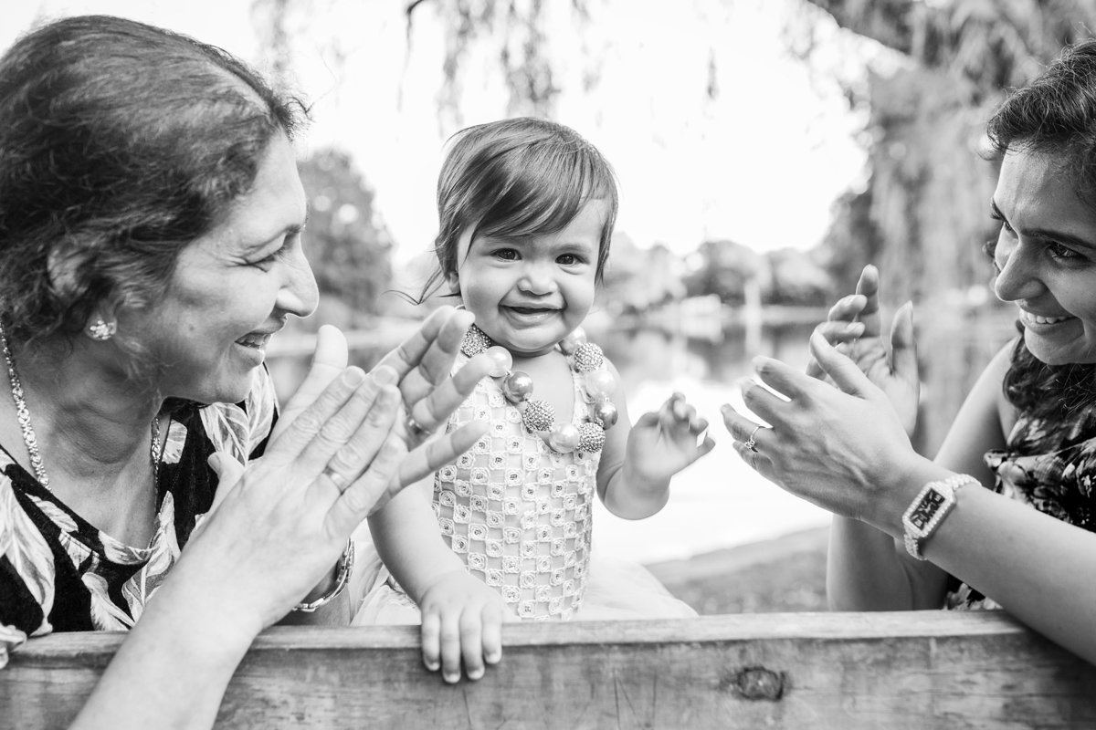 charlotte family photographer captures a beautiful black and white image of three generations playfully interacting