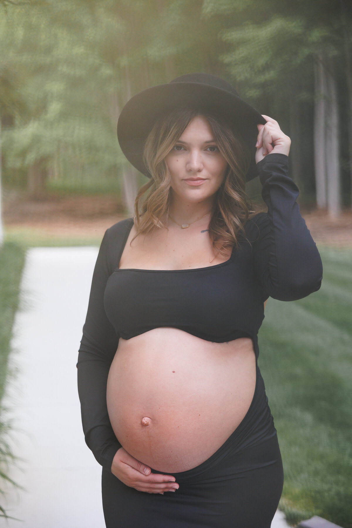 A beautiful photo of a pregnant woman showing off her baby bump Photo taken In Clio, MI 