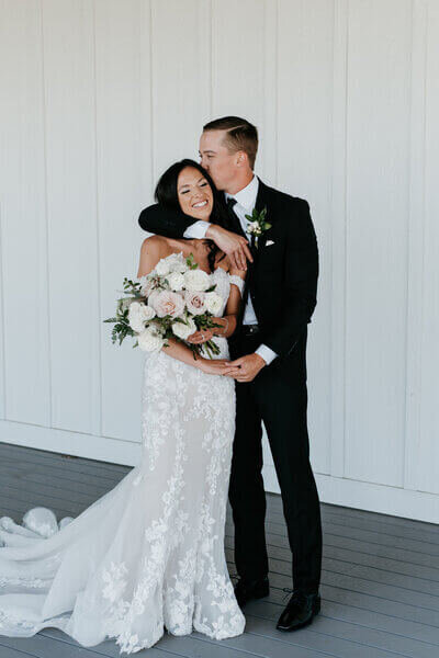 Groom kissing bride to show planning a wedding in chicago