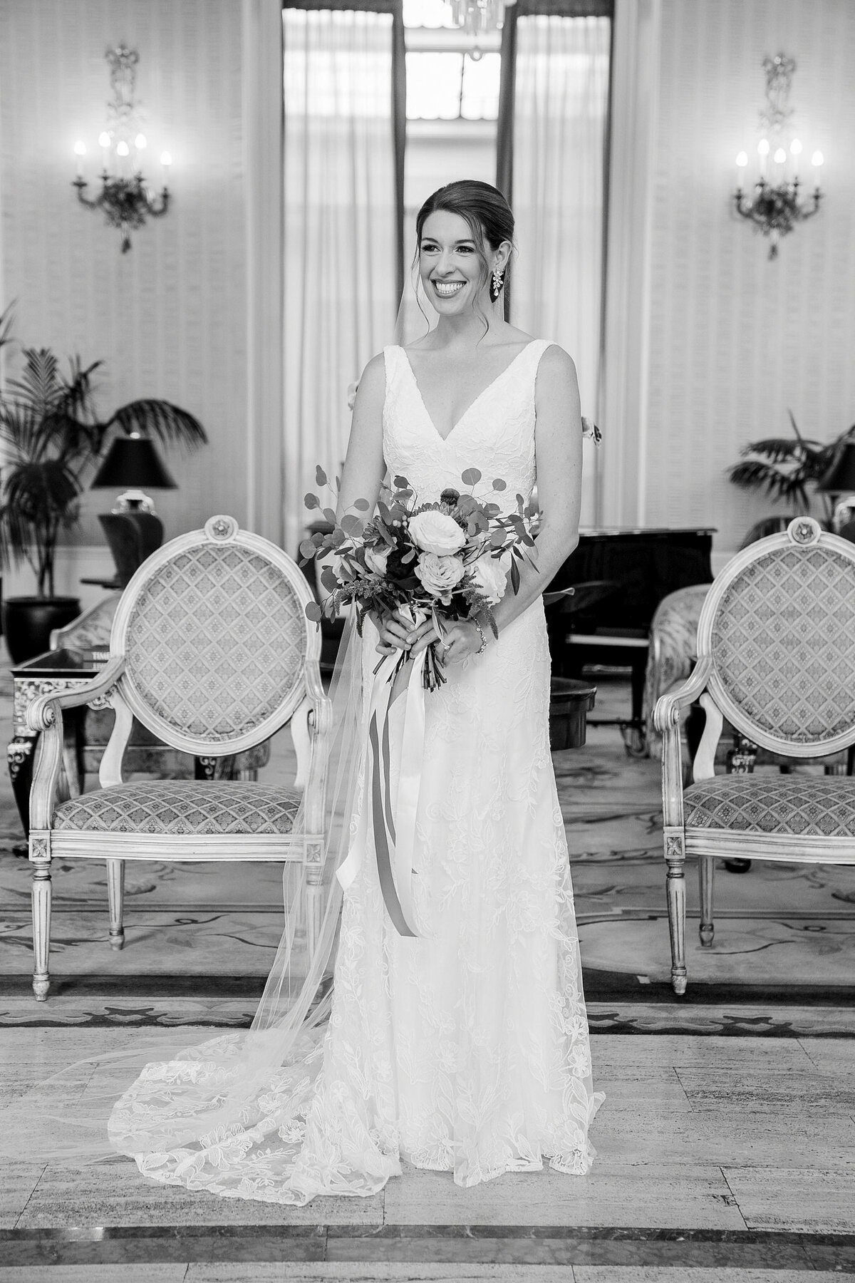 Black and white portrait of bride with bouquet