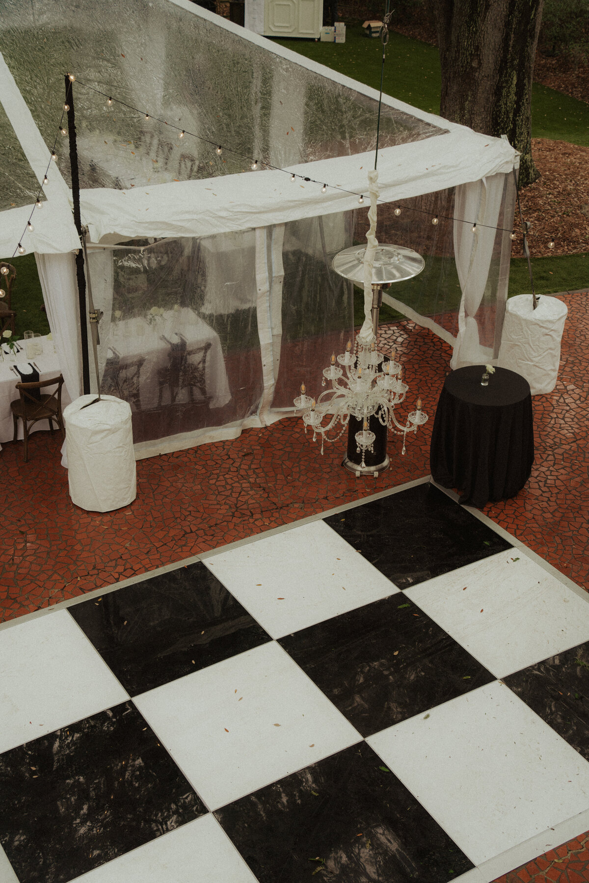 Wedding ceremony setup on the back lawn with the house as a dramatic backdrop