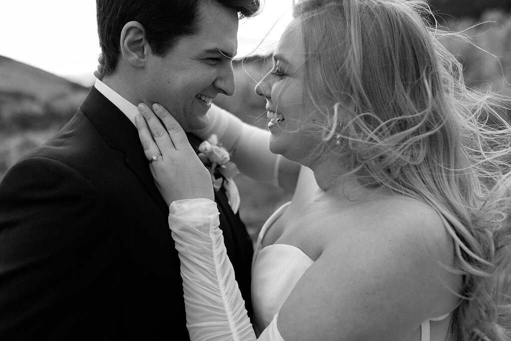 Couple laughing together by Court Amber Photography, joyful and adventurous wedding photographer in Calgary, Alberta. Featured on the Bronte Bride Vendor Guide.