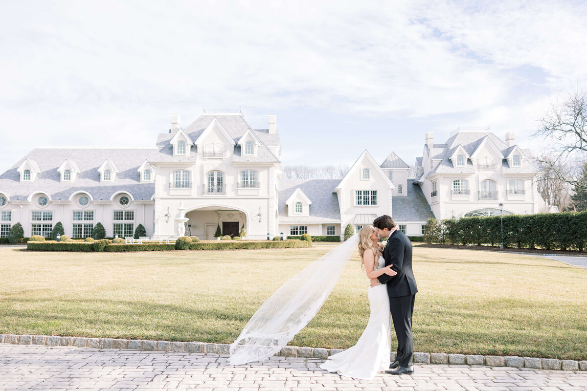 bride and groom out front of park chateau estate and gardens