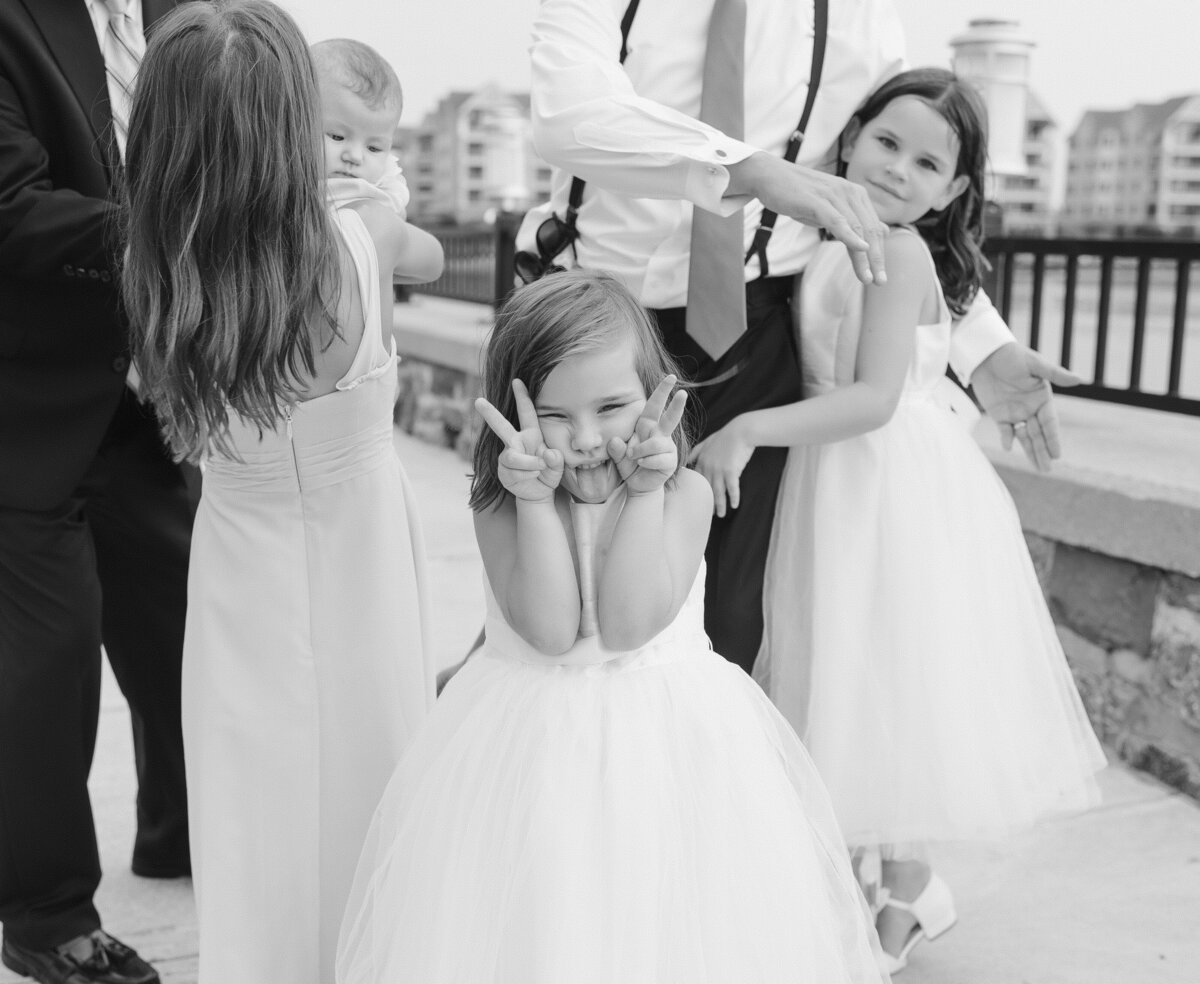 A cute flower girl being goofy