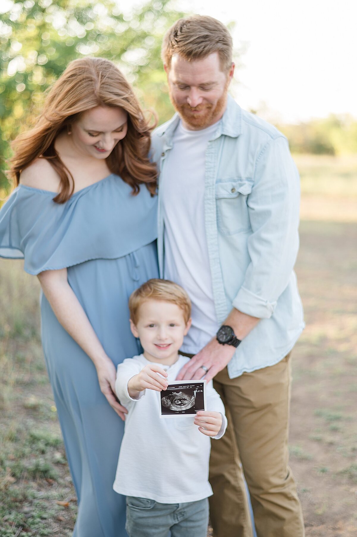 pregnancy announcement with big brother holding sonogram