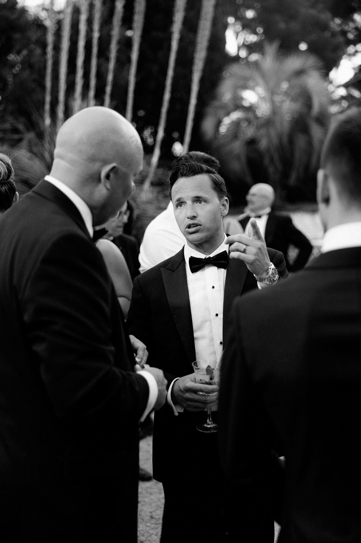 Guests chatting during the cocktail in formal attire.