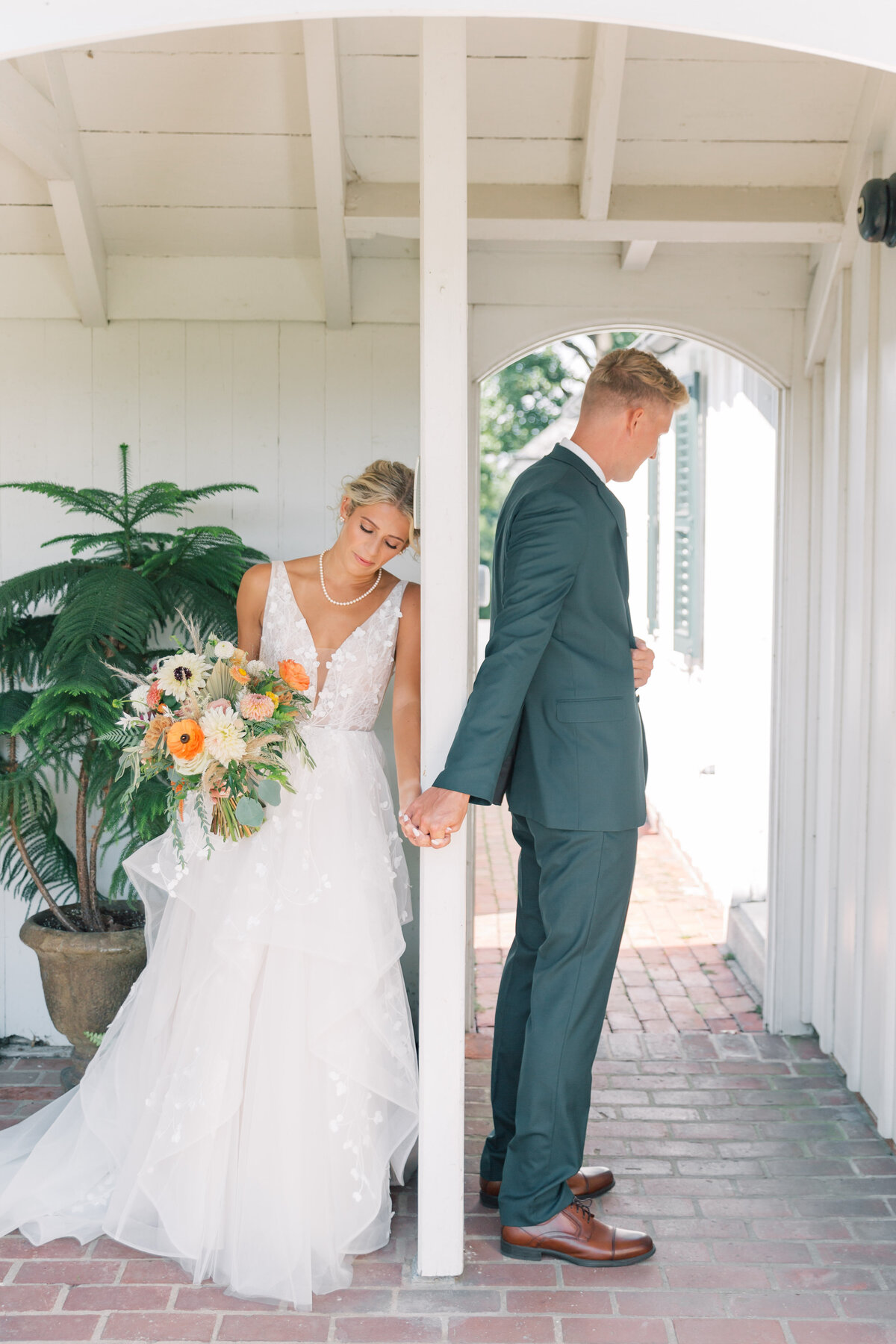 Couple doing a first touch on their wedding day at Drumore Estate