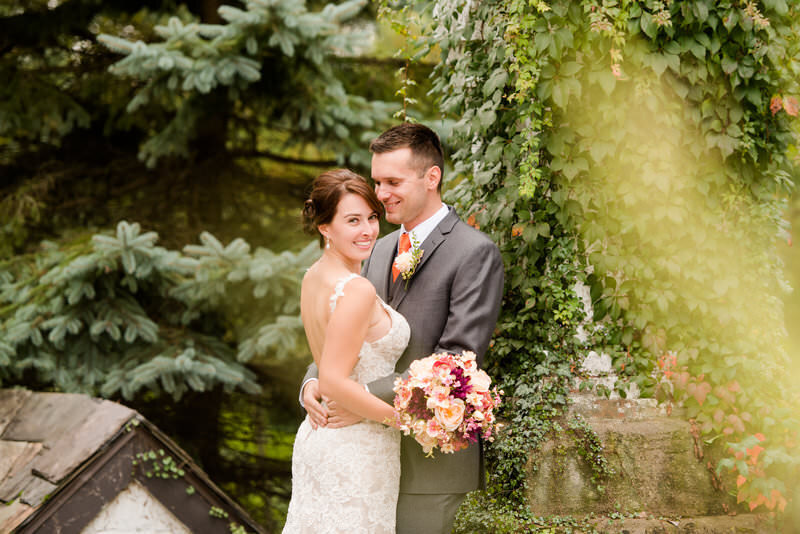 a photo of a couple on their wedding day in the Hyeholde scenery