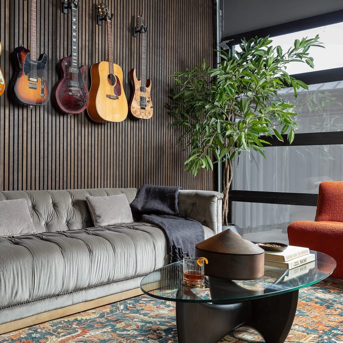 rebekah nicole interiors arbor garage with guitars on wall and tree in corner