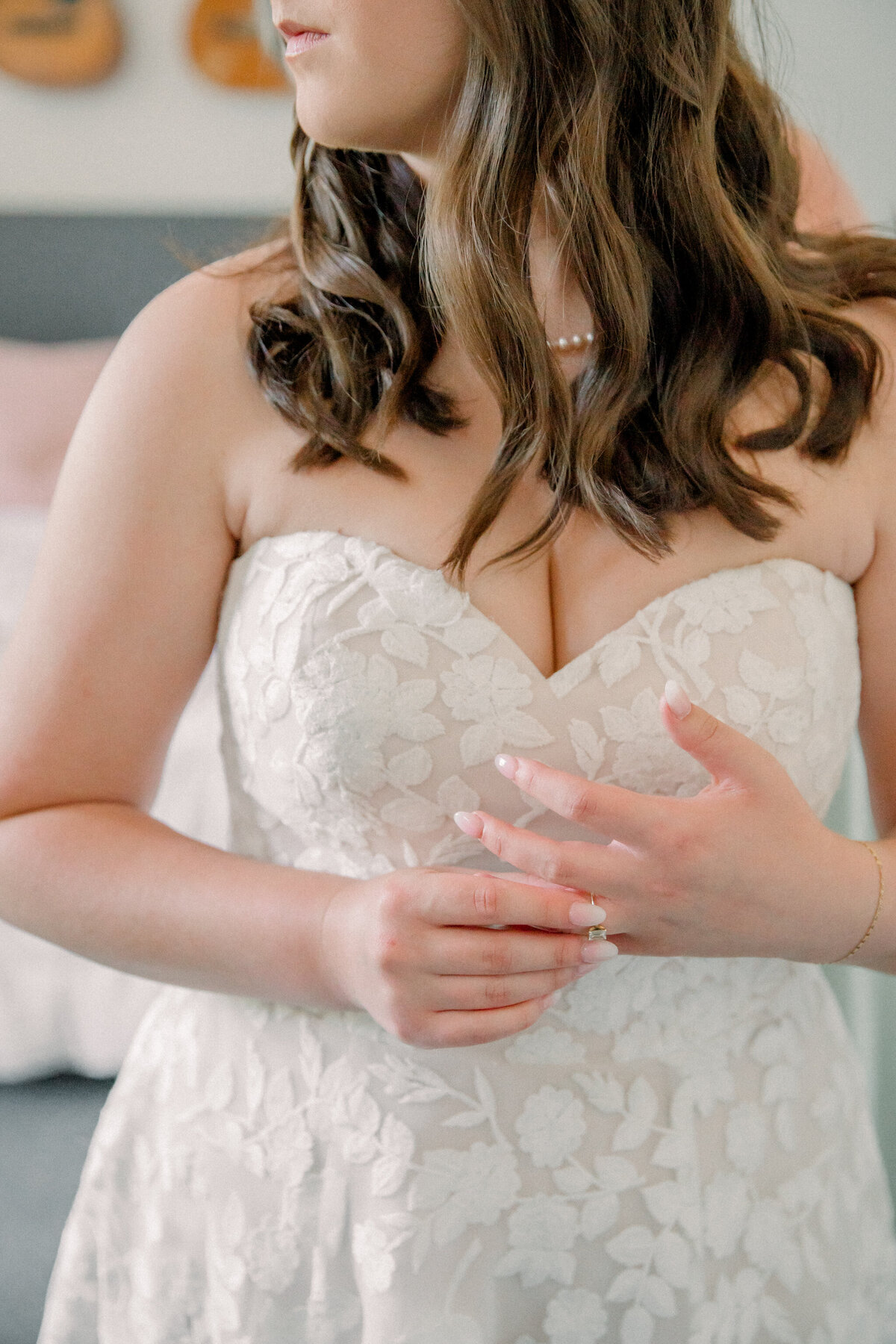 Bride adjusts her engagement ring while getting ready for her wedding ceremony at Three Oaks Manor in Virginia