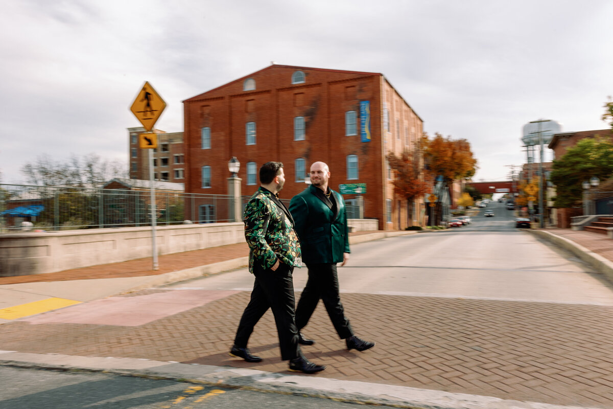 LGBTQ couple crossing the road on their wedding day in Frederick, Maryland
