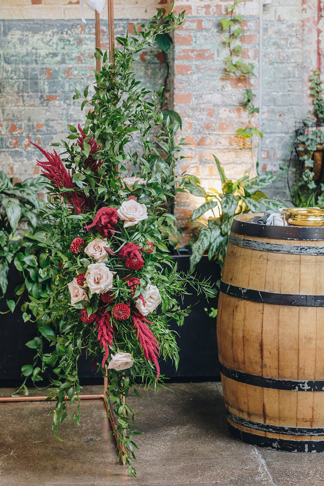 wedding ceremony space decorated with flowers from Lucy's Flowers at brooklyn Winery 