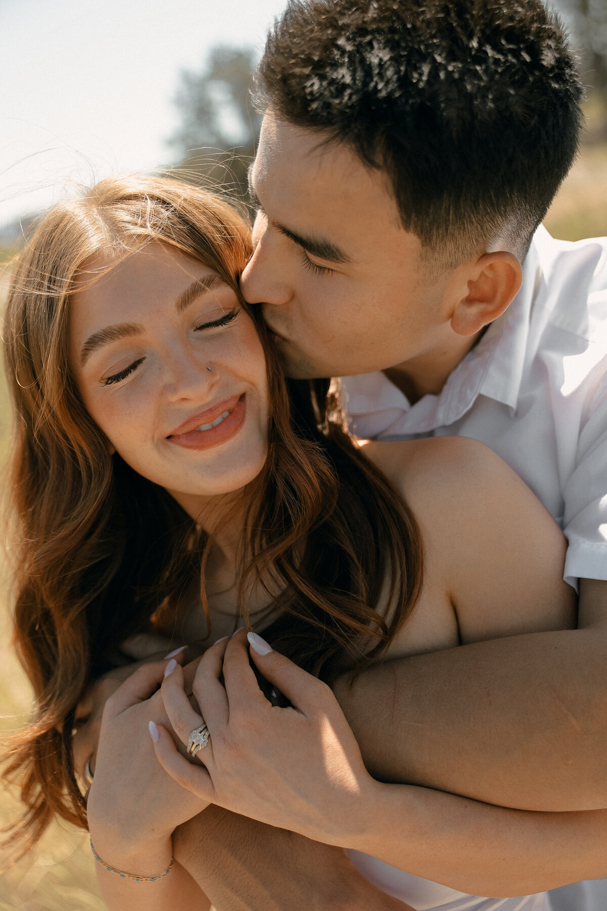 Soft Summer Couples Portrait in Wildflower Field at Sunset
