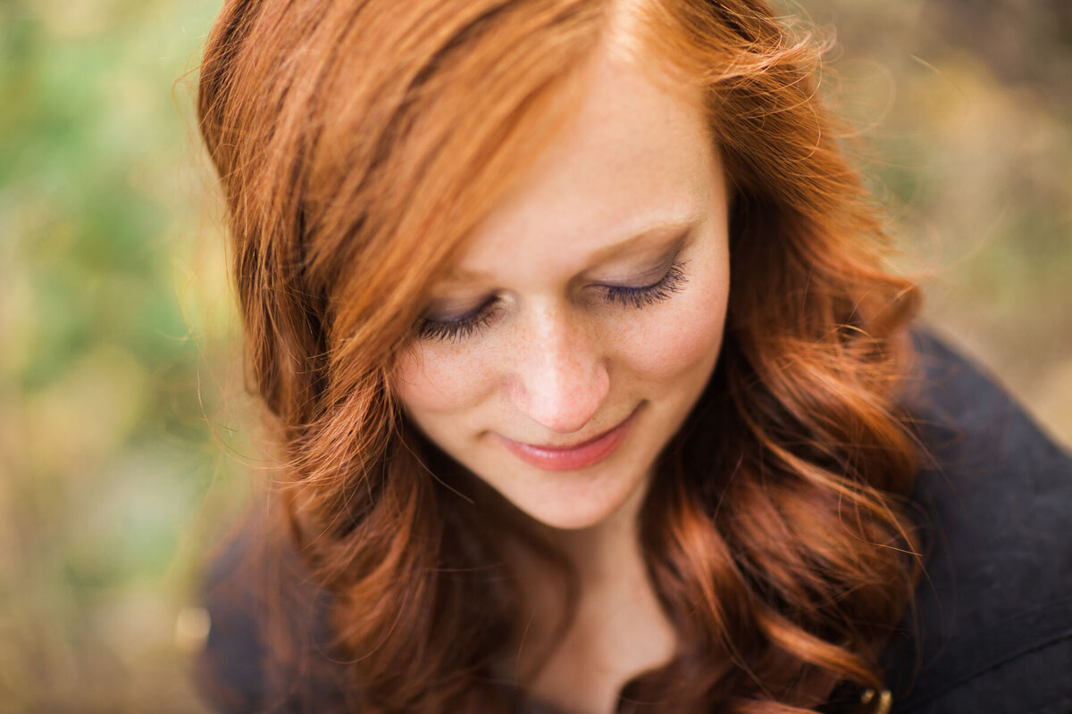 Detail shot of senior girl posing in autumn near Brighton Ski Resort in Utah.