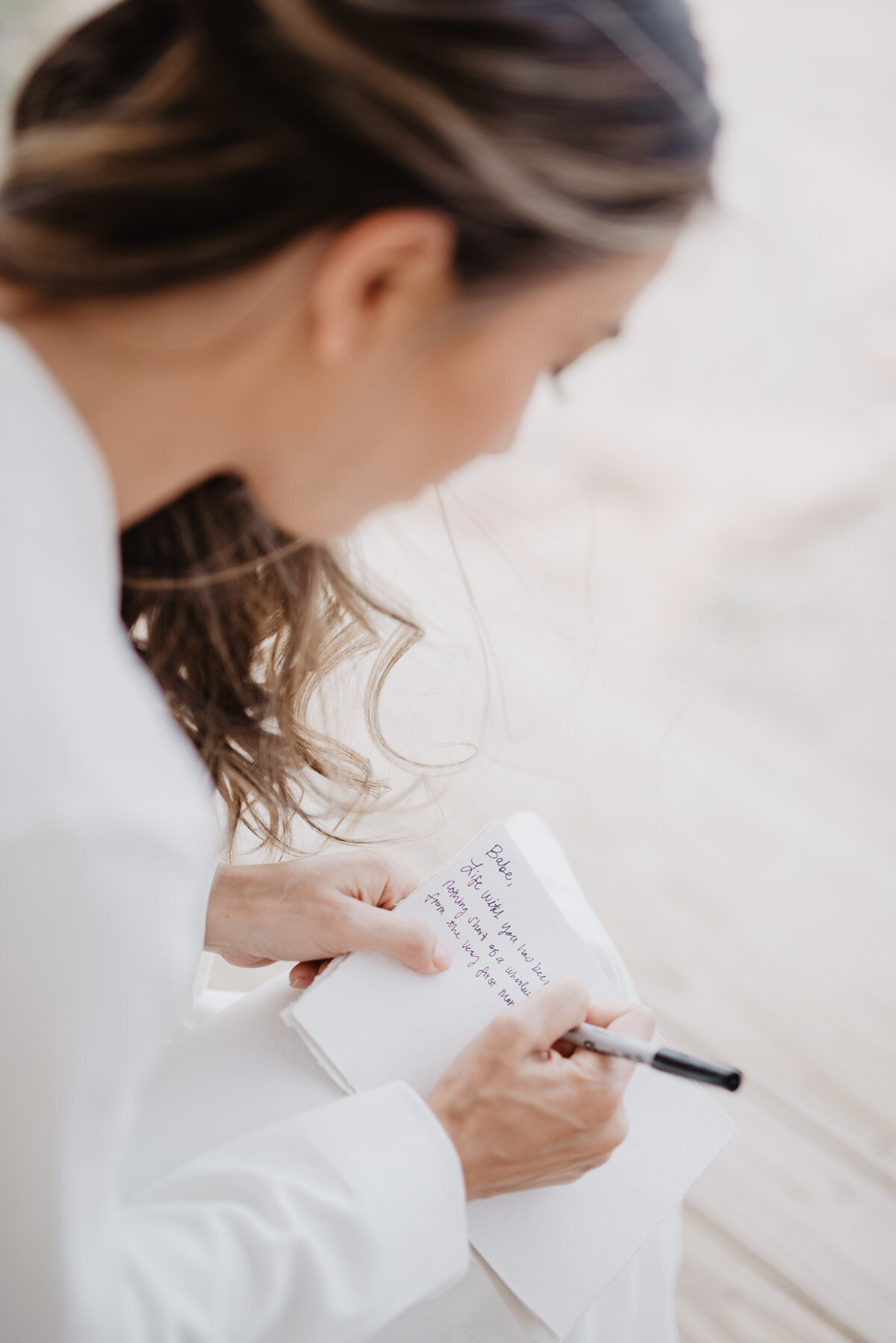 Utah Elopement Photographer captures woman writing vows