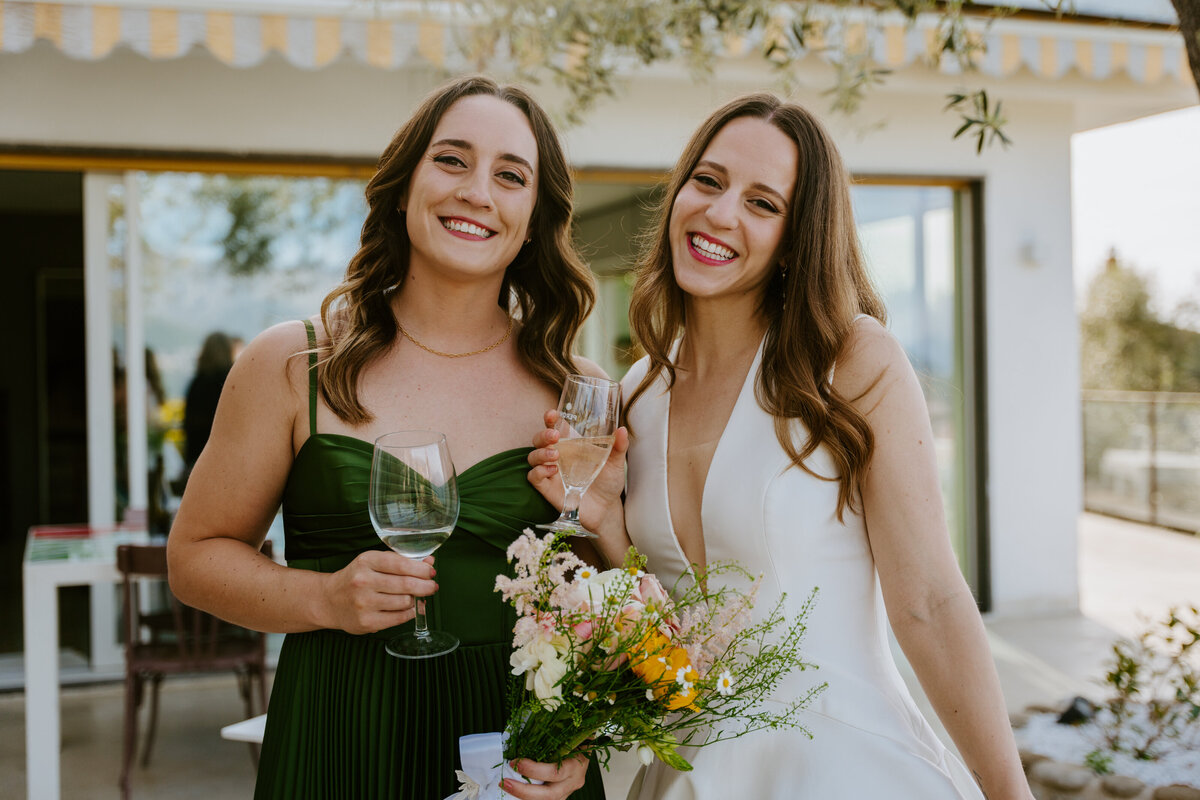 Friends celebrating with champagne on terrace